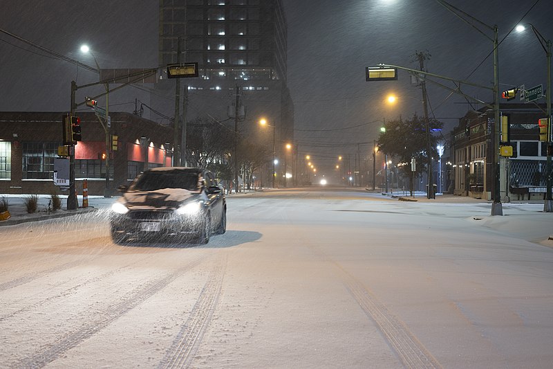 2021 Snow blizzard: snowy street with car: - Dallas Texas
